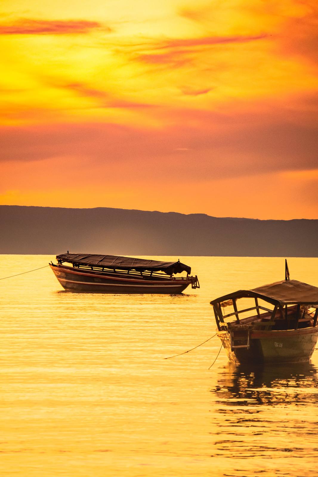 Fishing boats at sunset on Lake Victoria